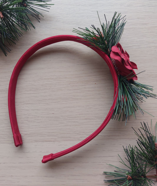 Red headband with green foliage and festive red rose