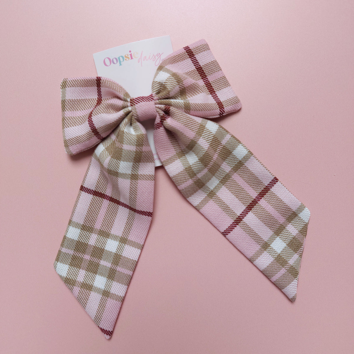 Long tartan hair bow in light pink with beige, white and burgundy checks