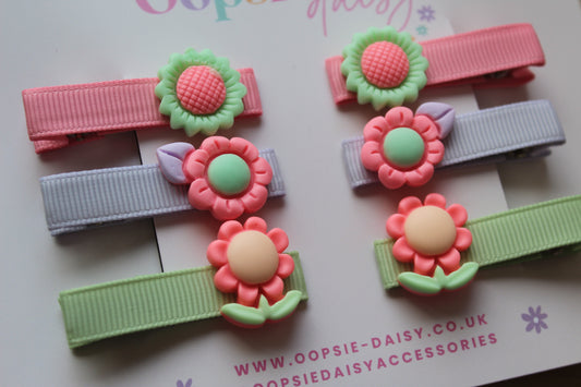 Set of colourful hair clips with floral designs