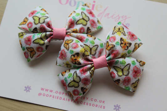 Pair colourful butterfly-themed hair bows