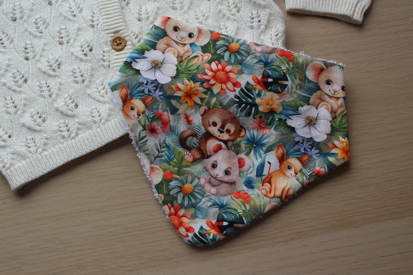baby animal dribble bib with jungle background