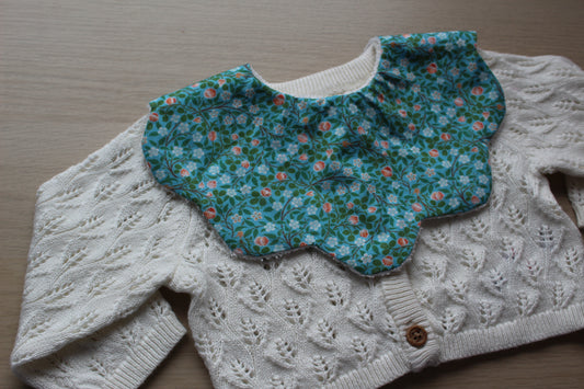 Teal ditsy floral patterned scallop bib