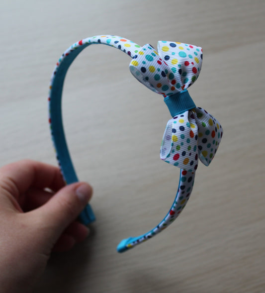 Colourful polka dot hairband with bow