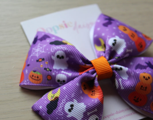 Halloween-themed purple bow with orange accents