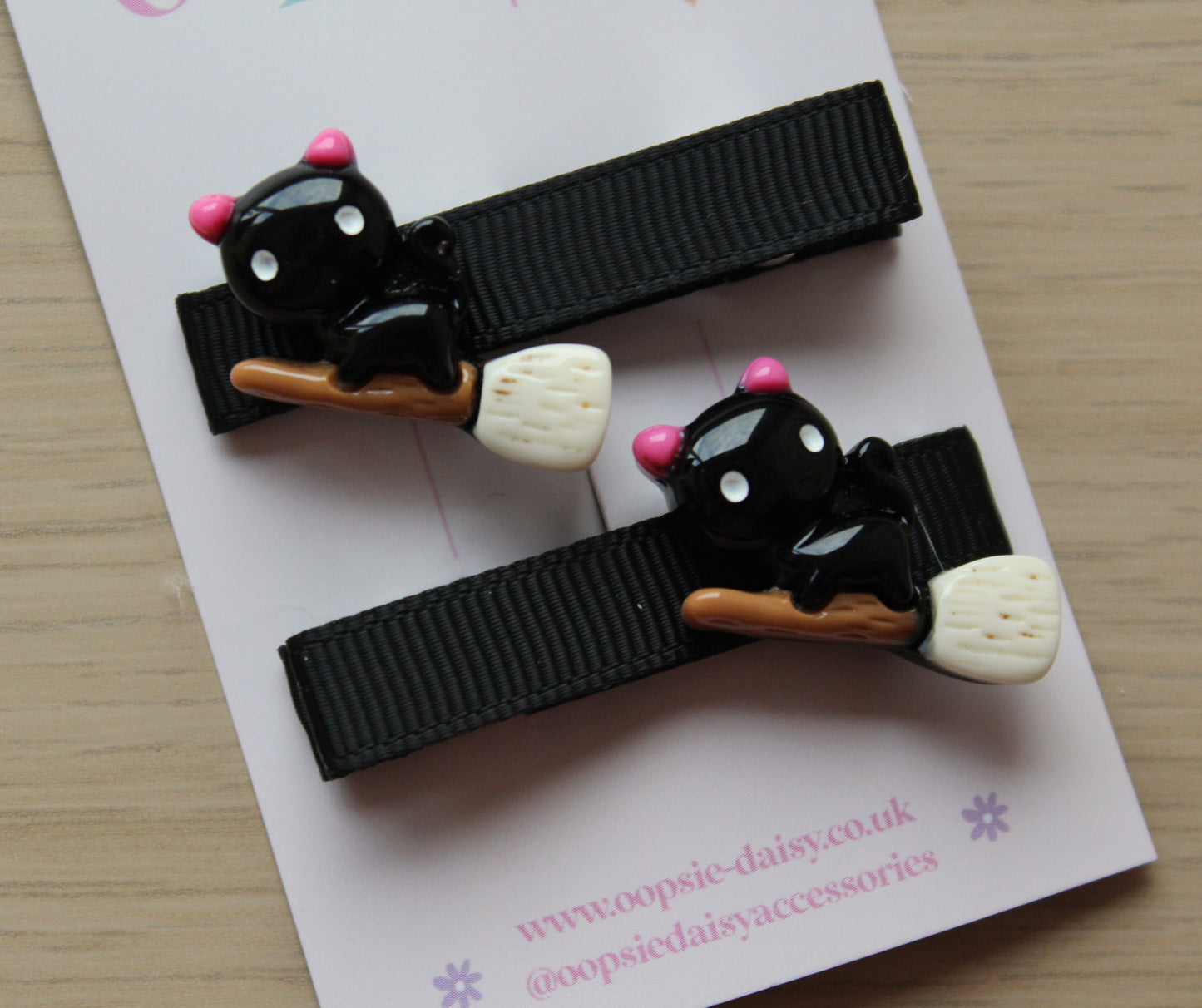 Halloween hair clips with black cat on broomstick