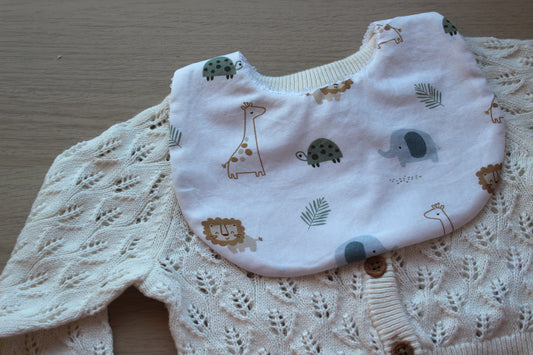 Baby bib with baby animal print on white background