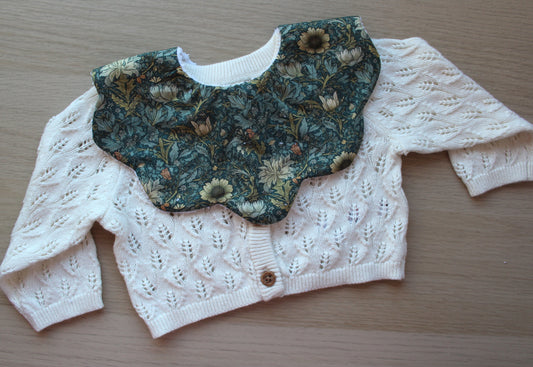 Dark green floral scallop baby bib