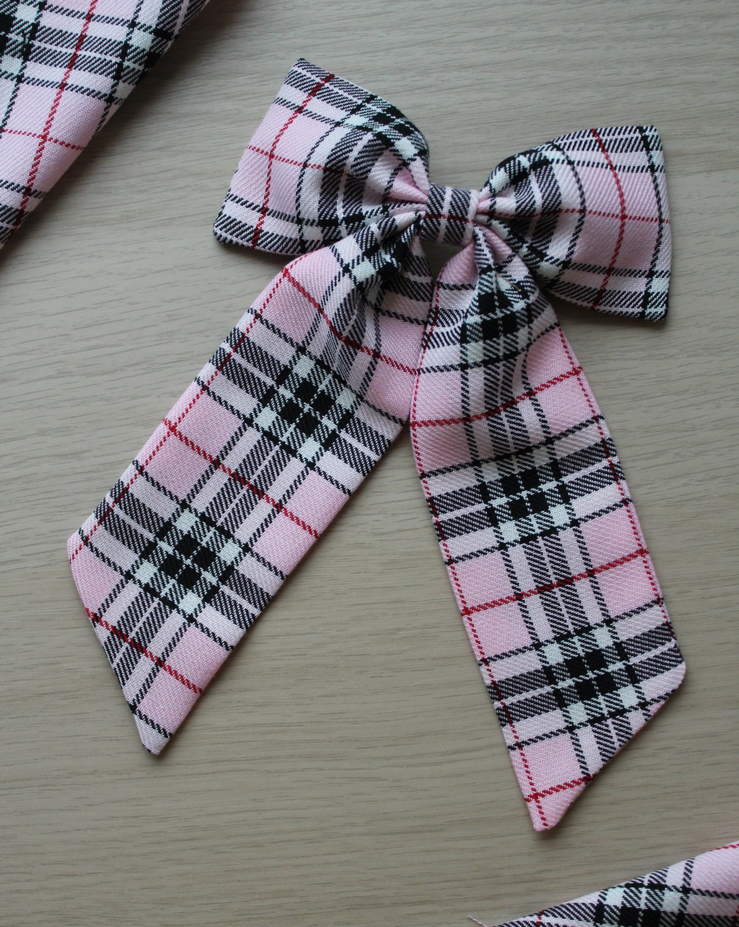 Pink and black plaid tartan hair bow