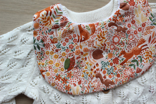 Round baby bib with woodland animals