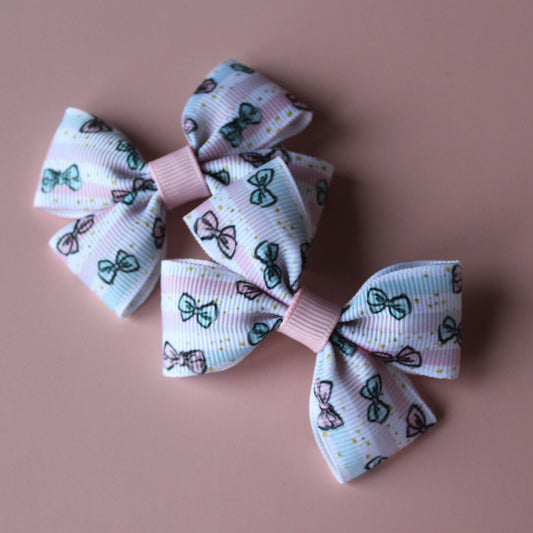 Pink and blue hair clips with bows