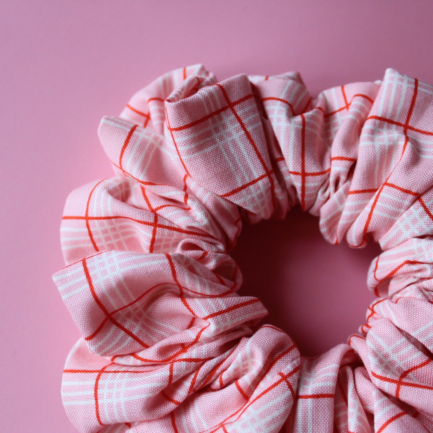 Pink oversized hair scrunchie with red and white check pattern
