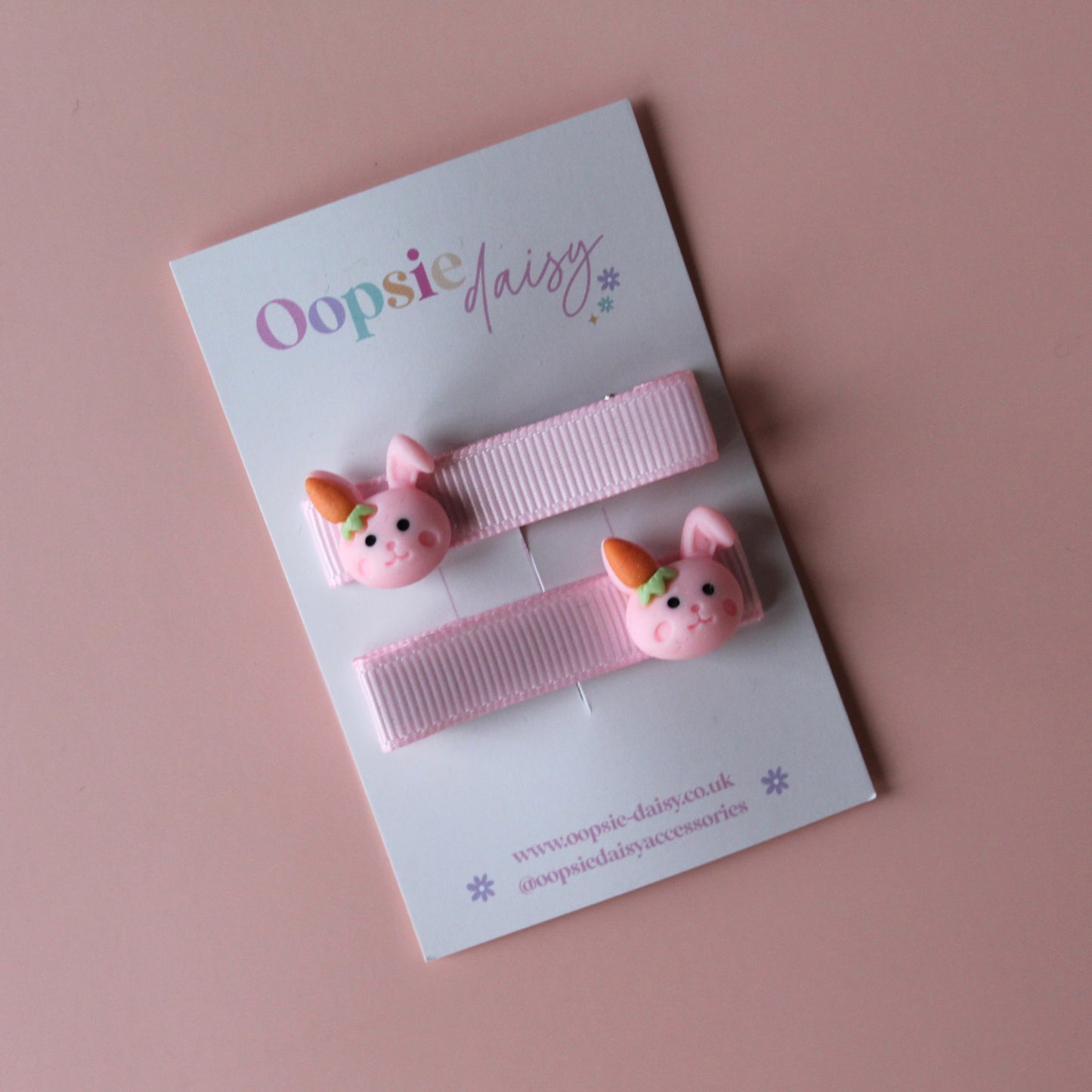 Pink hair clips with bunny rabbit embellishments