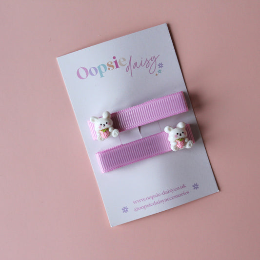 Pink hair clips with bunny rabbit embellishments