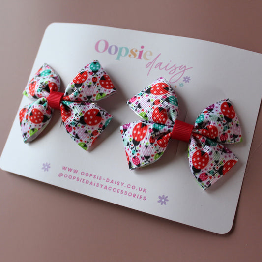 Hair bows with red and teal ladybird and polka dot pattern