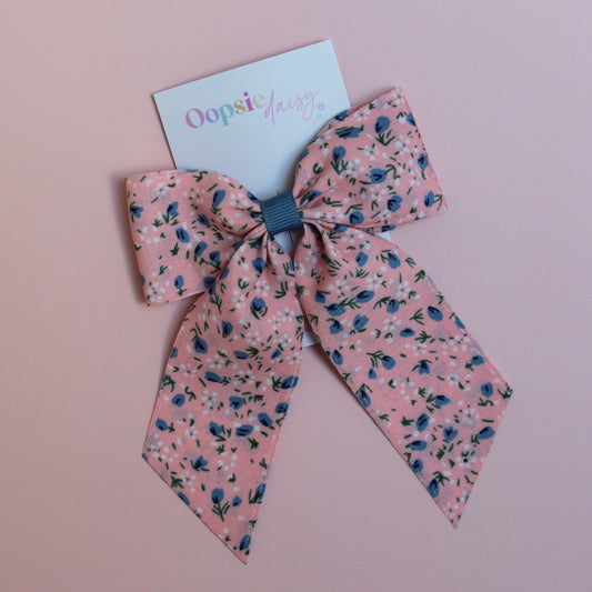 Pink hair bow with ditsy blue flowers