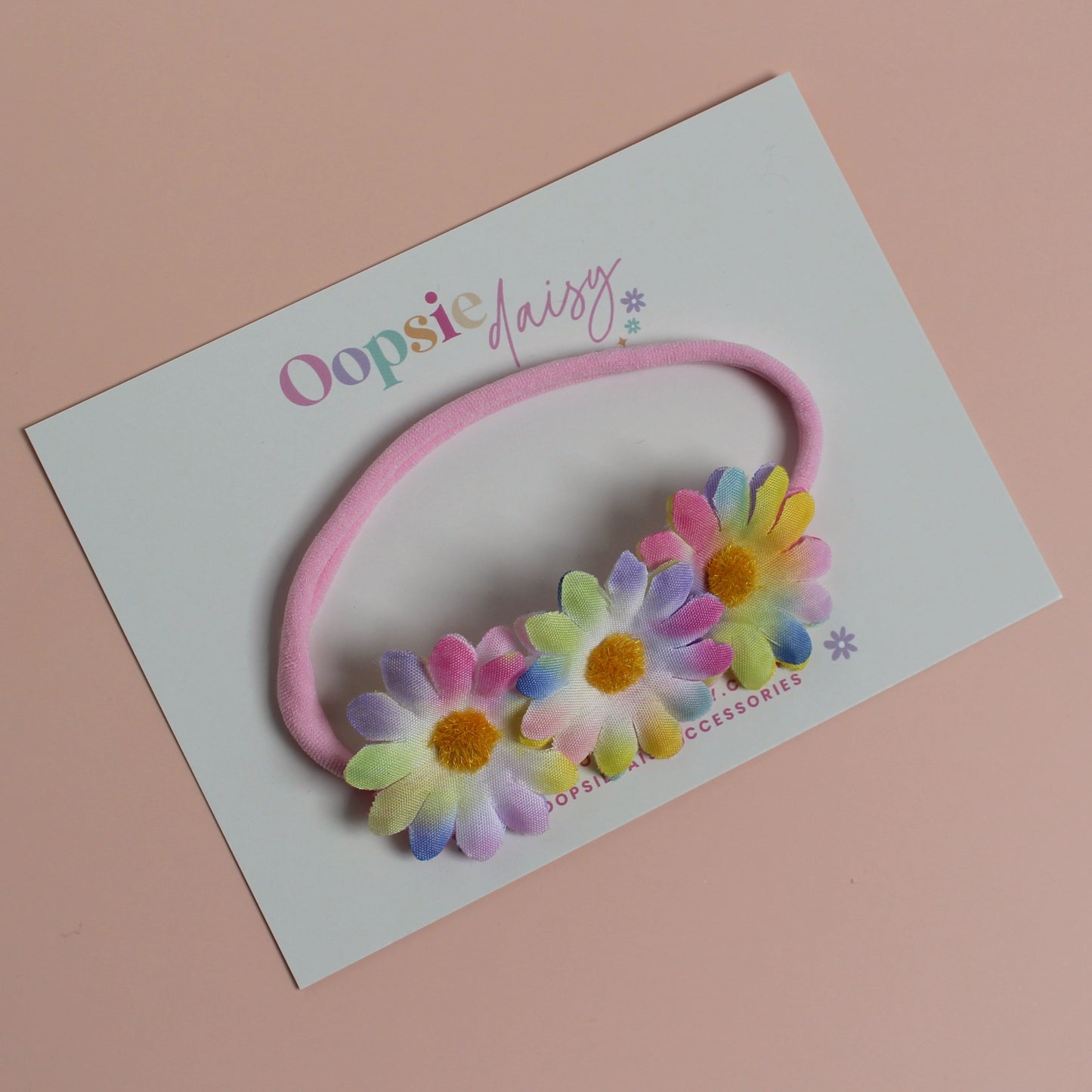 Pink baby headband with 3 multicolour daisy flowers