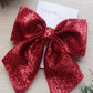 Red glittery festive hair bow