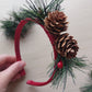 Festive headband with pine cones and foliage