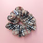 Thomson Camel tartan oversized hair scrunchie in beige, white, black and red tones. 