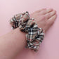 Thomson Camel tartan oversized hair scrunchie in beige, white, black and red tones. 