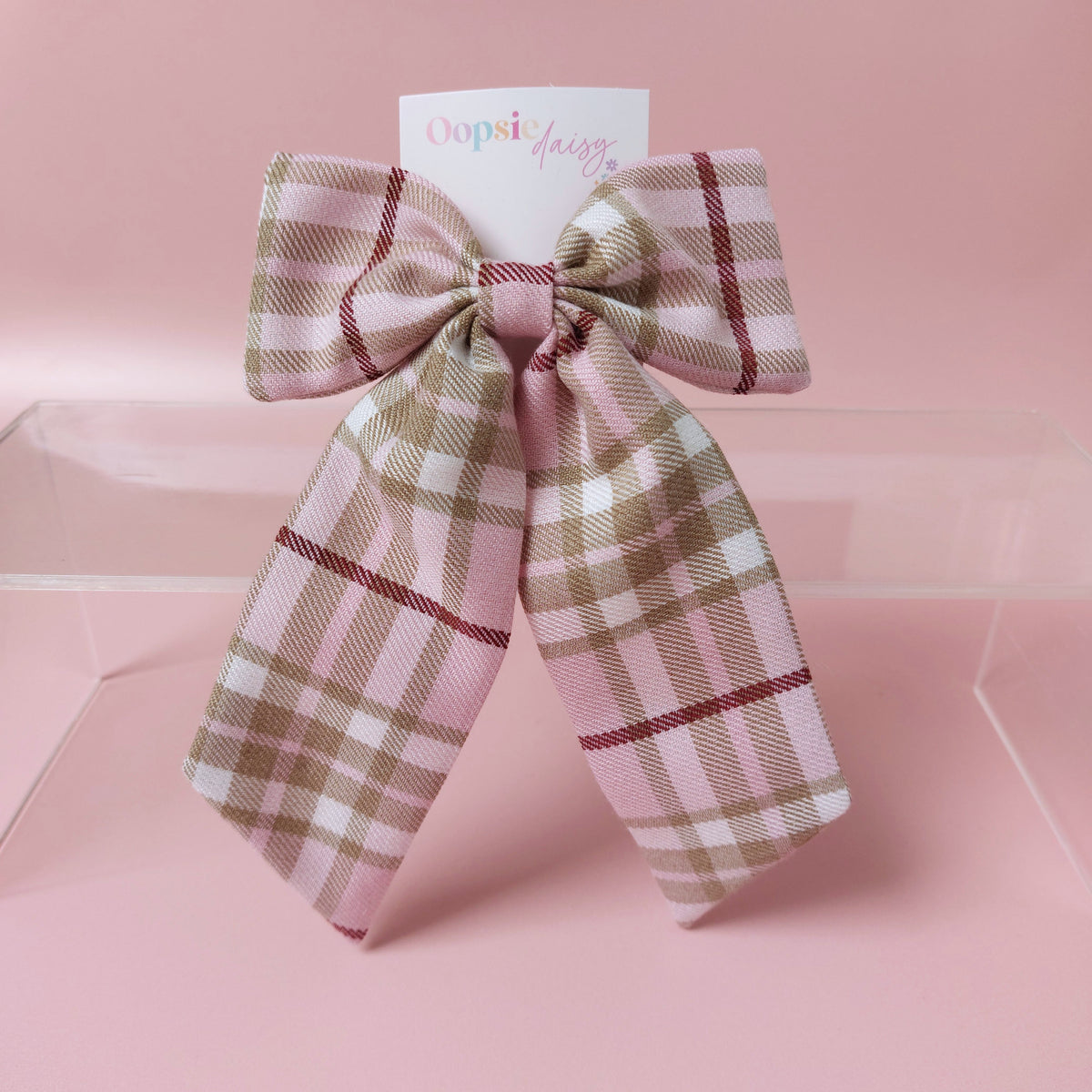 Long tartan hair bow in light pink with beige, white and burgundy  checks