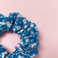 Blue hair scrunchie with ditsy off-white flowers