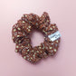 Warm brown scrunchie with small cream floral print. 