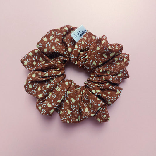 Brown oversized hair scrunchie with small cream ditsy flowers