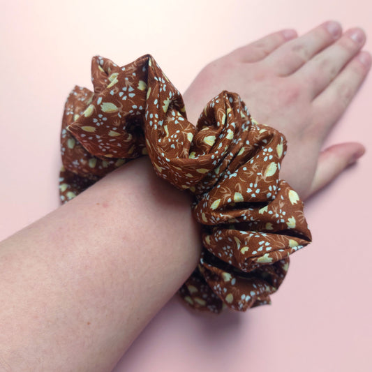 Brown oversized hair scrunchie with small cream ditsy flowers