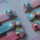 Blue & pink 3D hair slides with unicorn, rabbit and rainbow