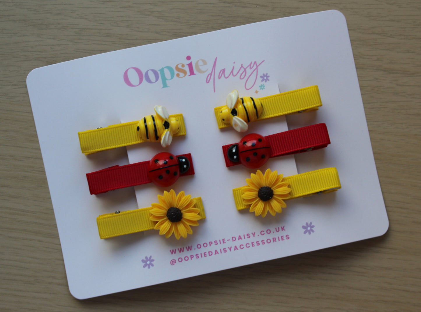 Yellow and red hair sliders with bees and ladybirds