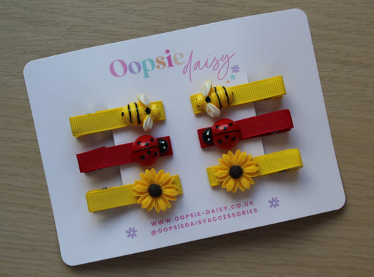 Yellow and red hair sliders with bees and ladybirds