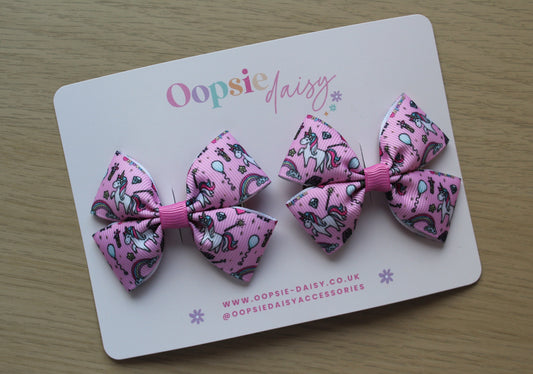 Pair pink hair bows with unicorn design