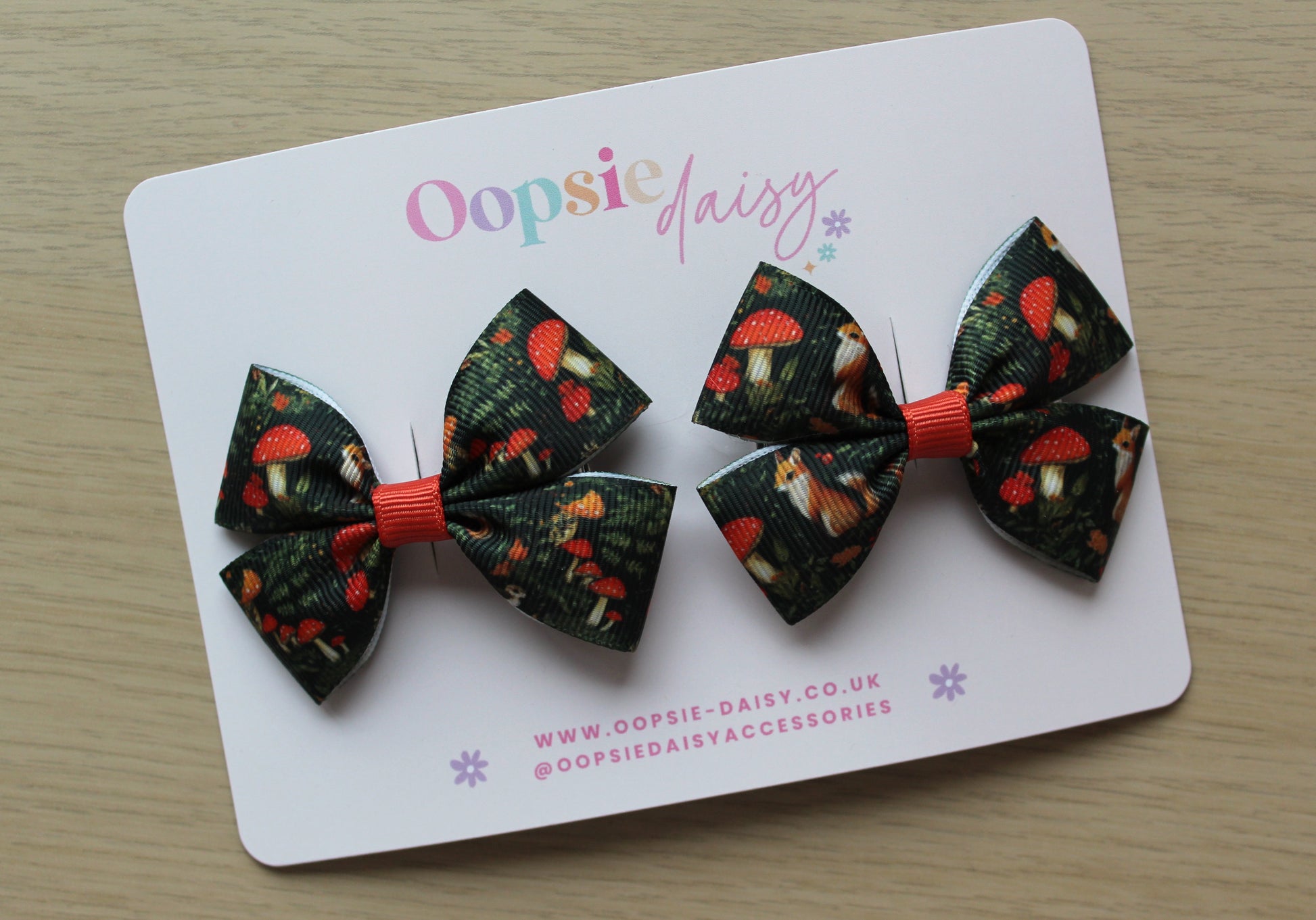 Pair forest-themed hair bows with foxes and toadstools