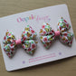 Pair hair bow clips with vintage butterfly design