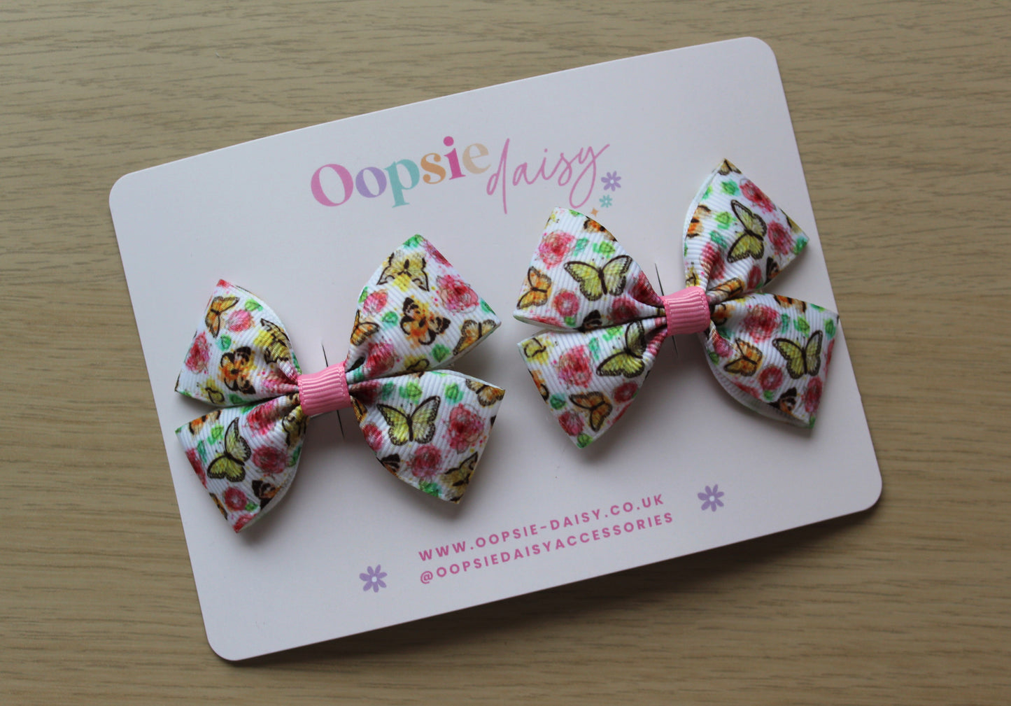 Pair hair bow clips with vintage butterfly design