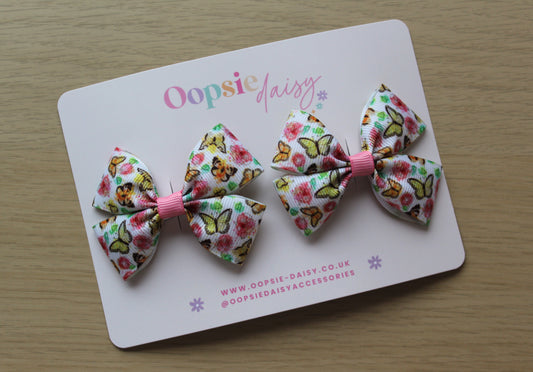Pair hair bow clips with vintage butterfly design