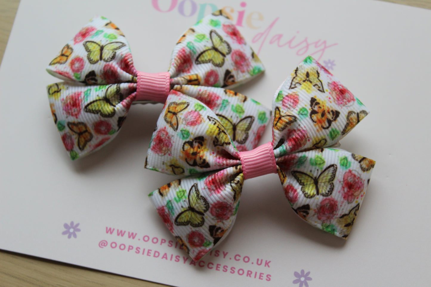 Pair colourful butterfly-themed hair bows 