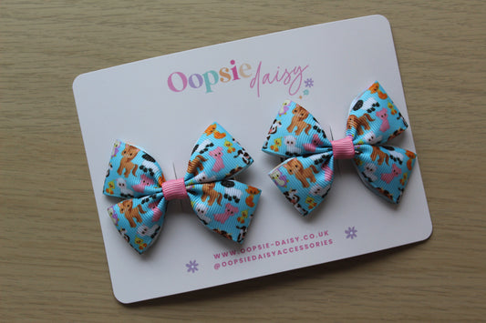 Pair colourful baby animal bow hair clips. 