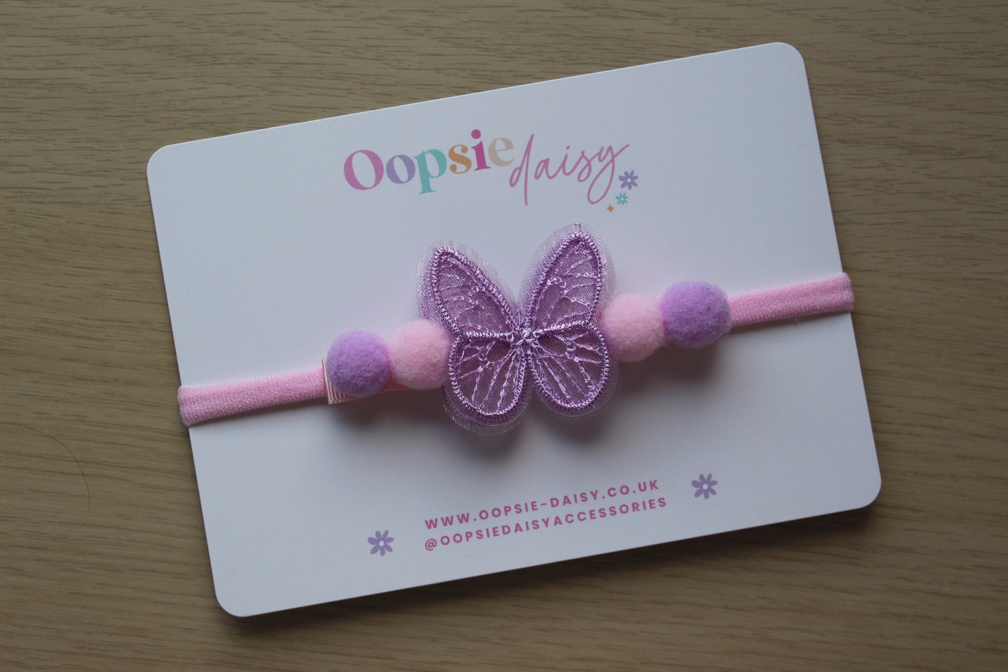 Pink and purple baby headband with butterfly