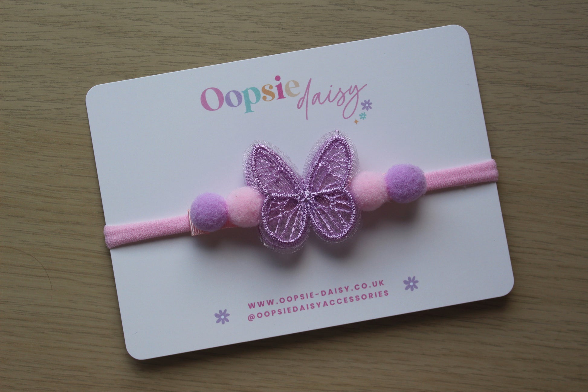 Pink and purple baby headband with butterfly