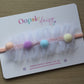 Baby headband with pom poms