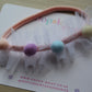 Headband with colourful pom poms