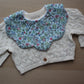 Ditsy blue flower scallop baby bib