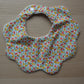 Scallop shaped baby bib with Liberty floral pattern