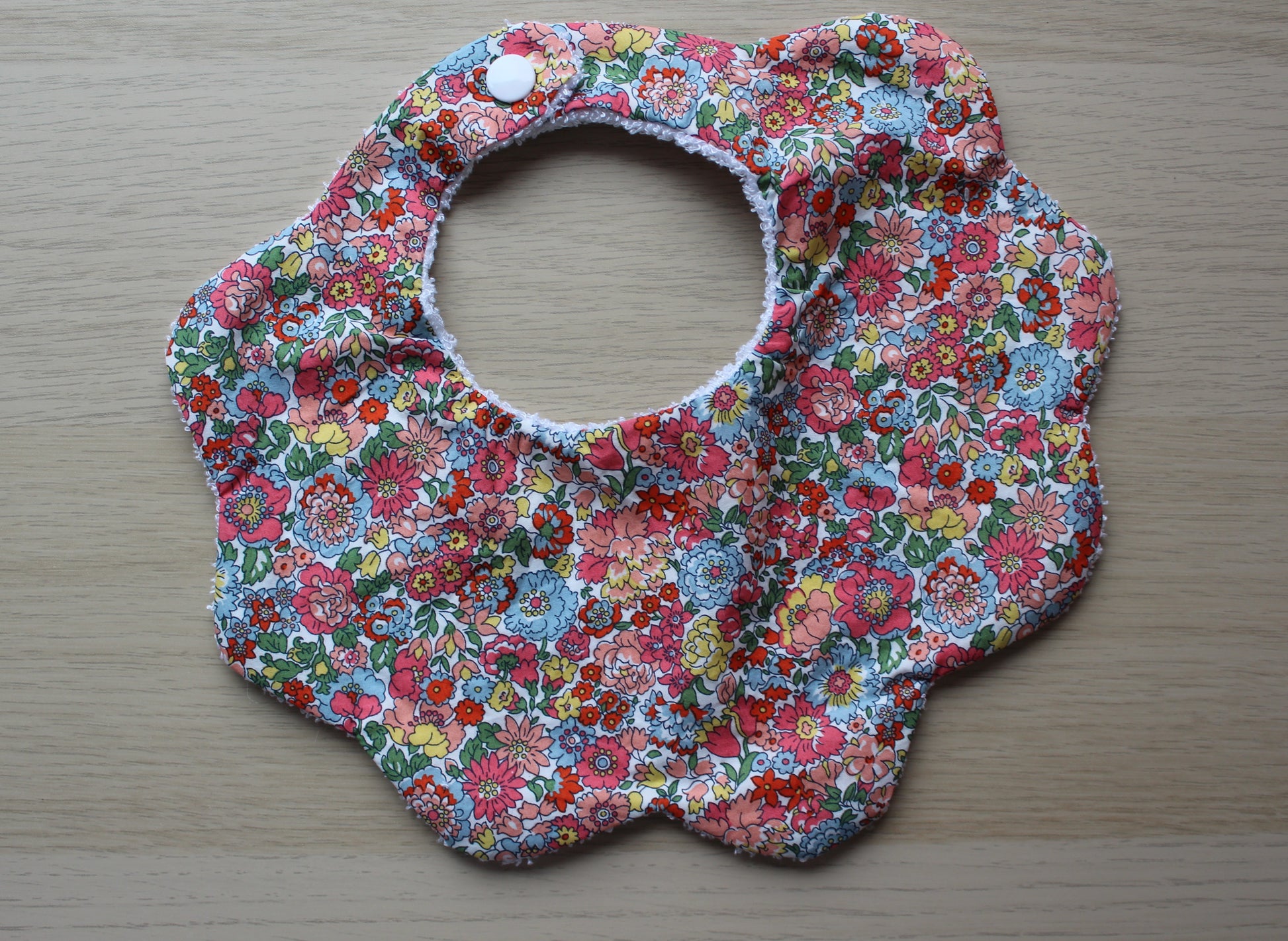 Scallop baby bib with Liberty floral design