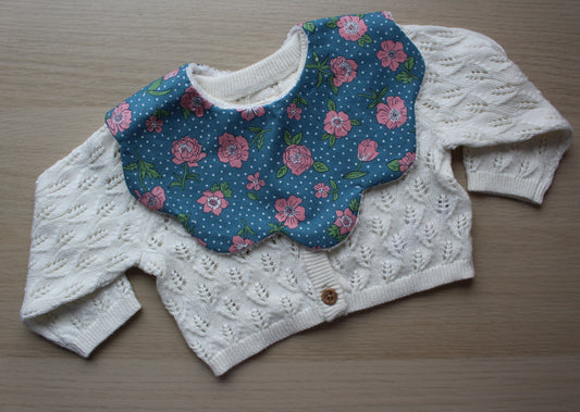 Rose and polka dot themed scallop baby bib