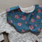 baby bib with roses and polka dots