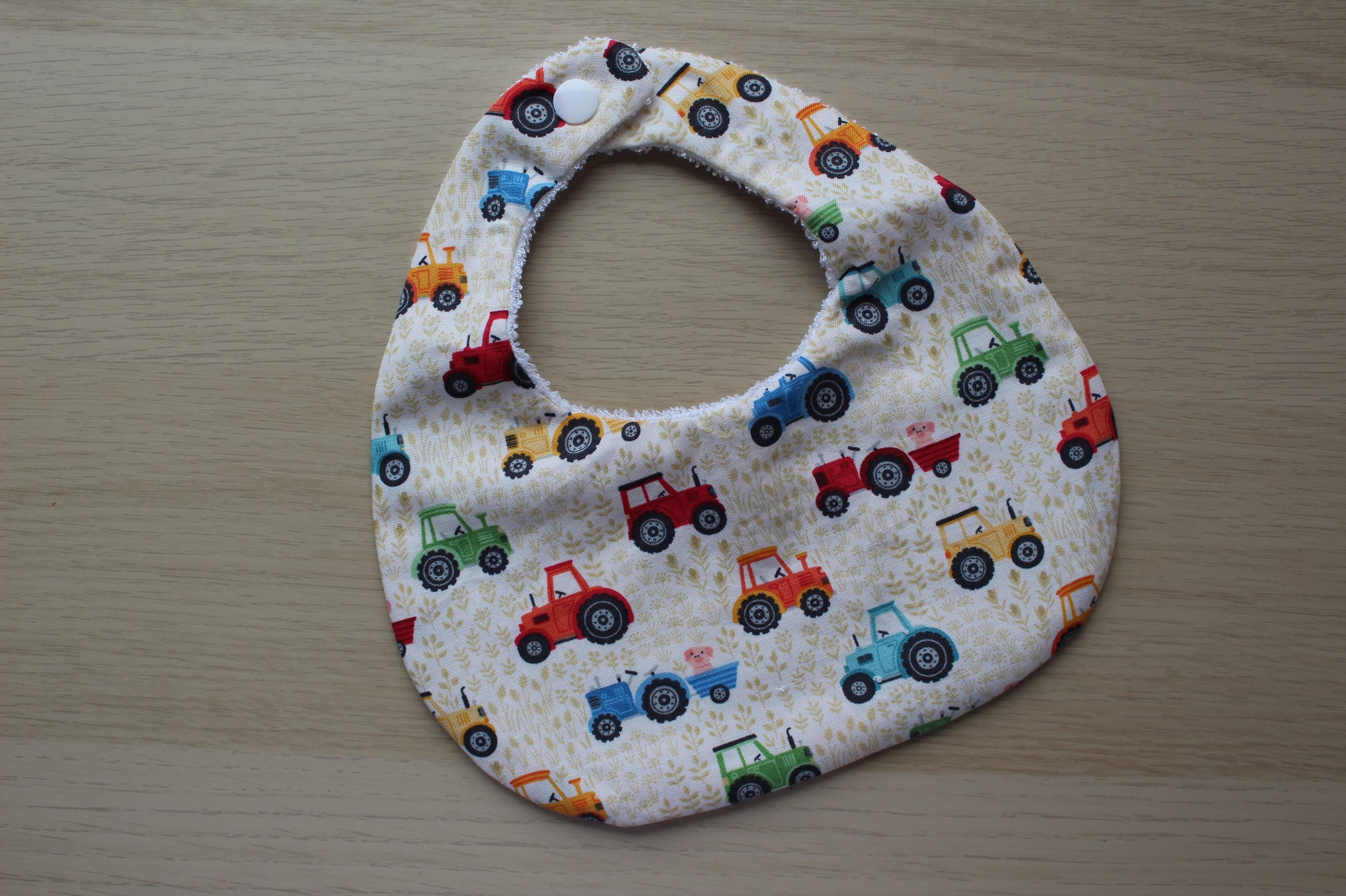 Tractor themed baby bib