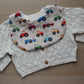 Baby bib with tractor theme